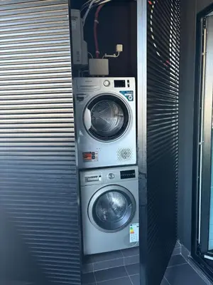 a washing machine and a dryer in a room at City View Condo in Funchal