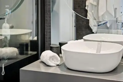 a bathroom with a large white bowl sink on a counter at City View Condo in Funchal