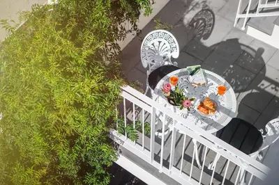 an overhead view of a table and chairs on a patio at Atelier by Real Vision in Funchal