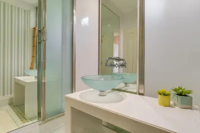 a bathroom with a glass bowl sink on a counter at Sublime View Villa by Atlantic Holiday in Funchal