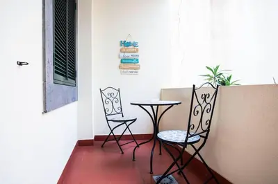 two chairs and a table in a room at Cantinho dos Netos in Funchal
