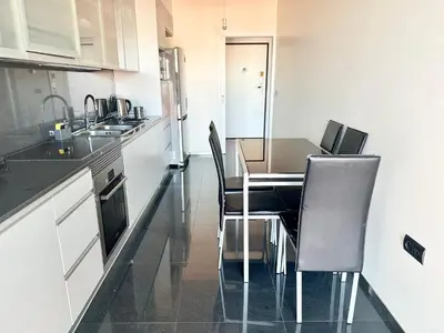 a bedroom with a bed and a large window at Rooms for Rent in Funchal in Funchal