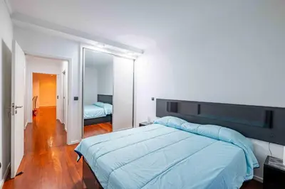 a kitchen with a dining table and a microwave at Rooms for Rent in Funchal in Funchal
