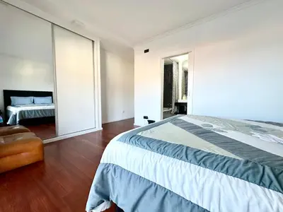 a living room with a dining room table and chairs at Rooms for Rent in Funchal in Funchal