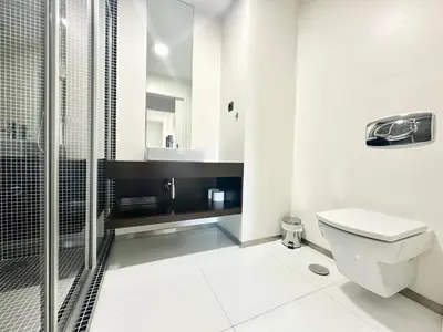 a bedroom with a bed and a dresser and a mirror at Rooms for Rent in Funchal in Funchal