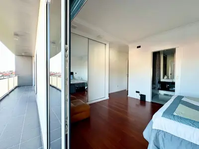 a living room with a table and chairs and a couch at Rooms for Rent in Funchal in Funchal