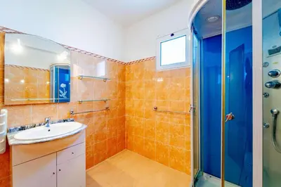 a bathroom with a sink and a shower at Alcantara Bell in Feiteiras