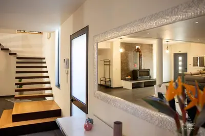 a hotel room with two beds and a mirror at Villa Karibo by ESCAPE to Madeira in Achada de Cima