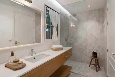 a bathroom with a sink and a mirror at Quinta Marefe - On the stunning west coast in Paul do Mar