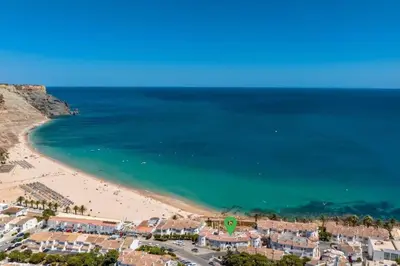 an aerial view of a beach and the ocean at Beachfront Apartment Praia da Luz by Blue Diamond 23B in Luz