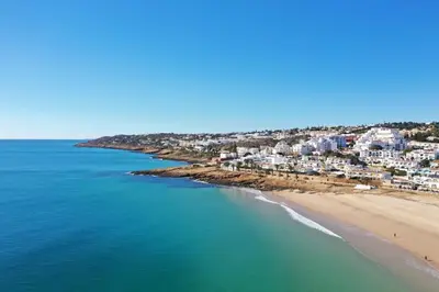 an aerial view of a beach and buildings at Beachfront Apartment Praia da Luz by Blue Diamond 23B in Luz