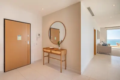 a dressing room with a mirror and a table at Beach View Apartment by Blue Diamond 101 in Lagos