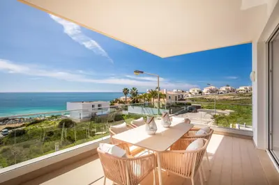 a dining room with a view of the ocean at Beach View Apartment by Blue Diamond 101 in Lagos
