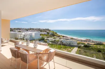 a dining room with a view of the ocean at Beach View Apartment by Blue Diamond 101 in Lagos