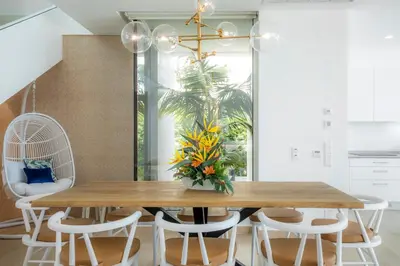 a dining room with a wooden table and chairs at Beach View Villa by Blue Diamond 55 in Lagos