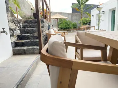 a living room with a couch and a chair at CHC Rochinha in Funchal
