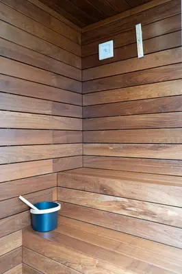 a sauna with a blue bucket in it at Blue Boat by Madeira Best Apartments in Funchal