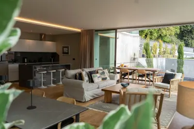 a living room with a couch and a table at Blue Boat by Madeira Best Apartments in Funchal