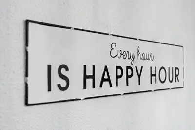 a sign on a wall that reads every team is happy hour at Cozy City Center Apartment in Funchal in Funchal