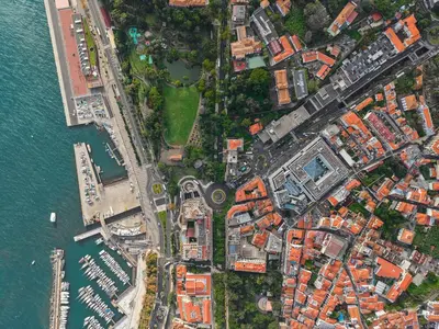 an overhead view of a city next to the water at Cozy City Center Apartment in Funchal in Funchal