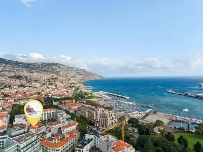 an aerial view of a city and the ocean at Cozy City Center Apartment in Funchal in Funchal
