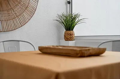 a table with a cutting board on top of it at Cozy City Center Apartment in Funchal in Funchal