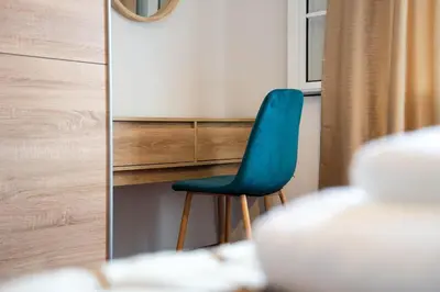 a blue chair sitting in front of a mirror at Vila Verde in Tábua