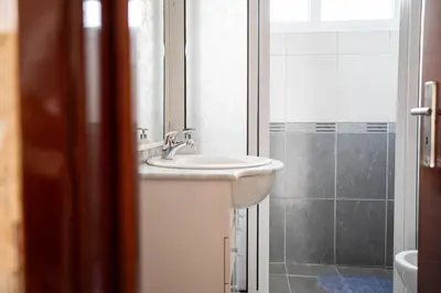 a bathroom with a sink and a shower at Vila Verde in Tábua