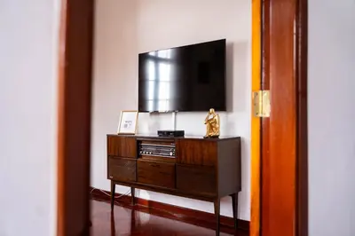 a tv on top of a dresser in a room at Vila Verde in Tábua