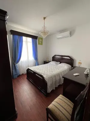 a bedroom with a bed and a desk and a window at Casa Nova - Maison avec garage, terrasse & Balcon in Ponta do Sol