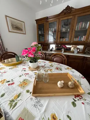 a table with a wooden tray with flowers on it at Casa Nova - Maison avec garage, terrasse & Balcon in Ponta do Sol