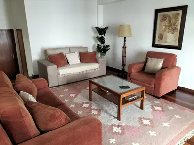a living room with two couches and a coffee table at Hortasol A in Funchal