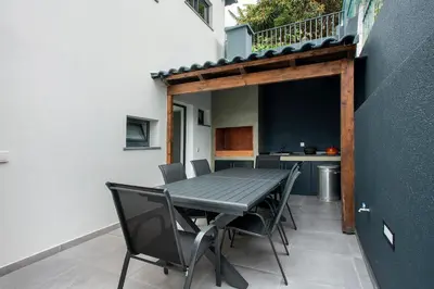 a swimming pool on the roof of a building at Villa Angela in Funchal