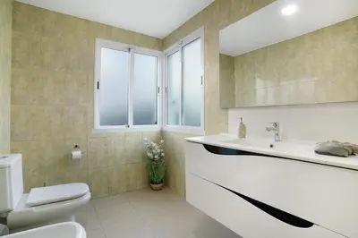 a bathroom with a toilet and a sink at Pico Do Paraíso in Funchal