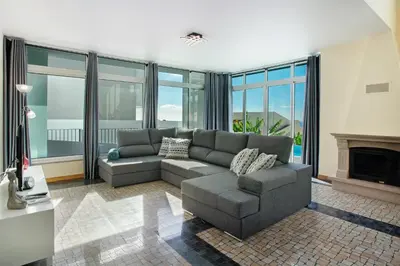 a living room with a couch and a fireplace at Pico Do Paraíso in Funchal