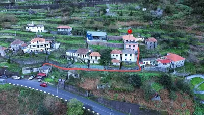 a house on a hill with a red road at Casa Vicente II, By OP in Boaventura