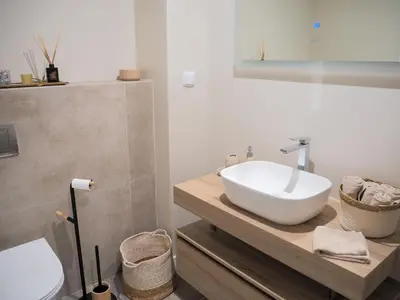 a bathroom with a sink and a toilet at Imperatriz Madeira Apartment in Funchal