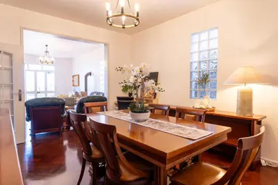 a dining room with a table and chairs at Sallys in Ponta do Sol