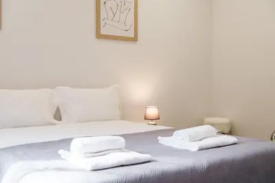 a bedroom with a bed with two towels on it at GuestReady - Tranquil Hideaway near Funchal in Funchal