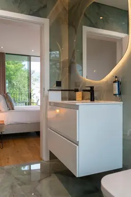 a bathroom with a sink and a mirror at Green Boat by Madeira Best Apartments in Funchal