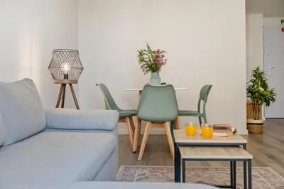 a living room with a couch and chairs at Carmo Heritage Apartments in Funchal