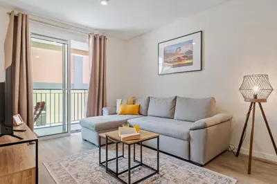 a living room with a couch and a table at Carmo Heritage Apartments in Funchal
