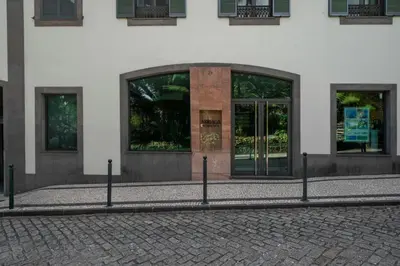 a building with glass doors on the side of it at Arriaga Residence I by An Island Apart in Funchal