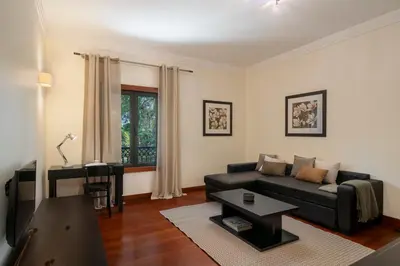 a living room with a couch and a table at Arriaga Residence I by An Island Apart in Funchal