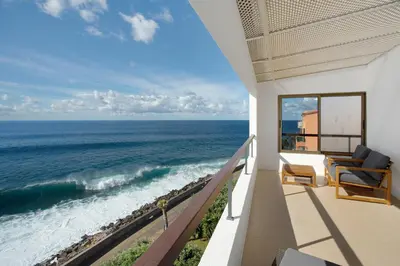 a balcony with a view of the ocean at The Yellow House in Jardim do Mar