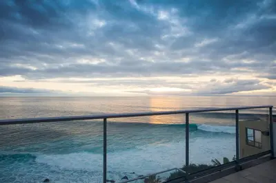 a view of the ocean from the balcony of a condo at The Wave House - Oceanfront in Jardim do Mar