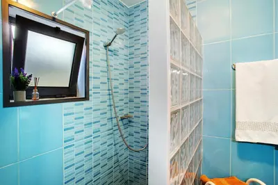 a bedroom with a bed and a window at The Wave House - Two Bedroom Flat in Jardim do Mar