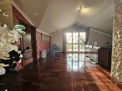 a living room with a wooden floor and a large window at Villa River Ponta do Sol by Rentallido in Canhas