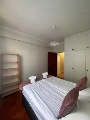a bedroom with a bed with two towels on it at Casa Valhalla in Funchal