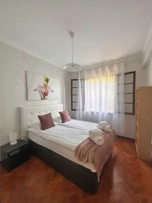 a bedroom with a large bed in a room at Casa Valhalla in Funchal